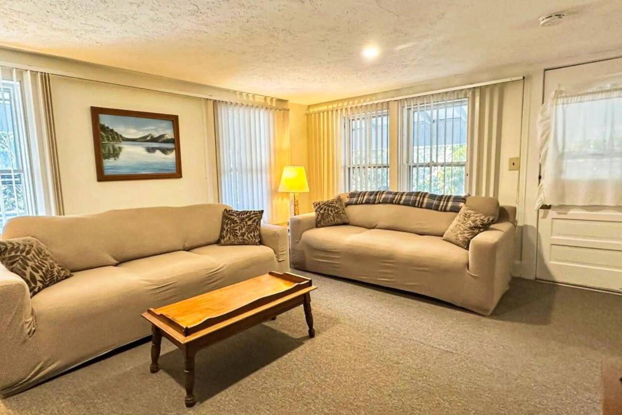 a living room with two couches and a coffee table at Ledgewood 7 in Seal Harbor