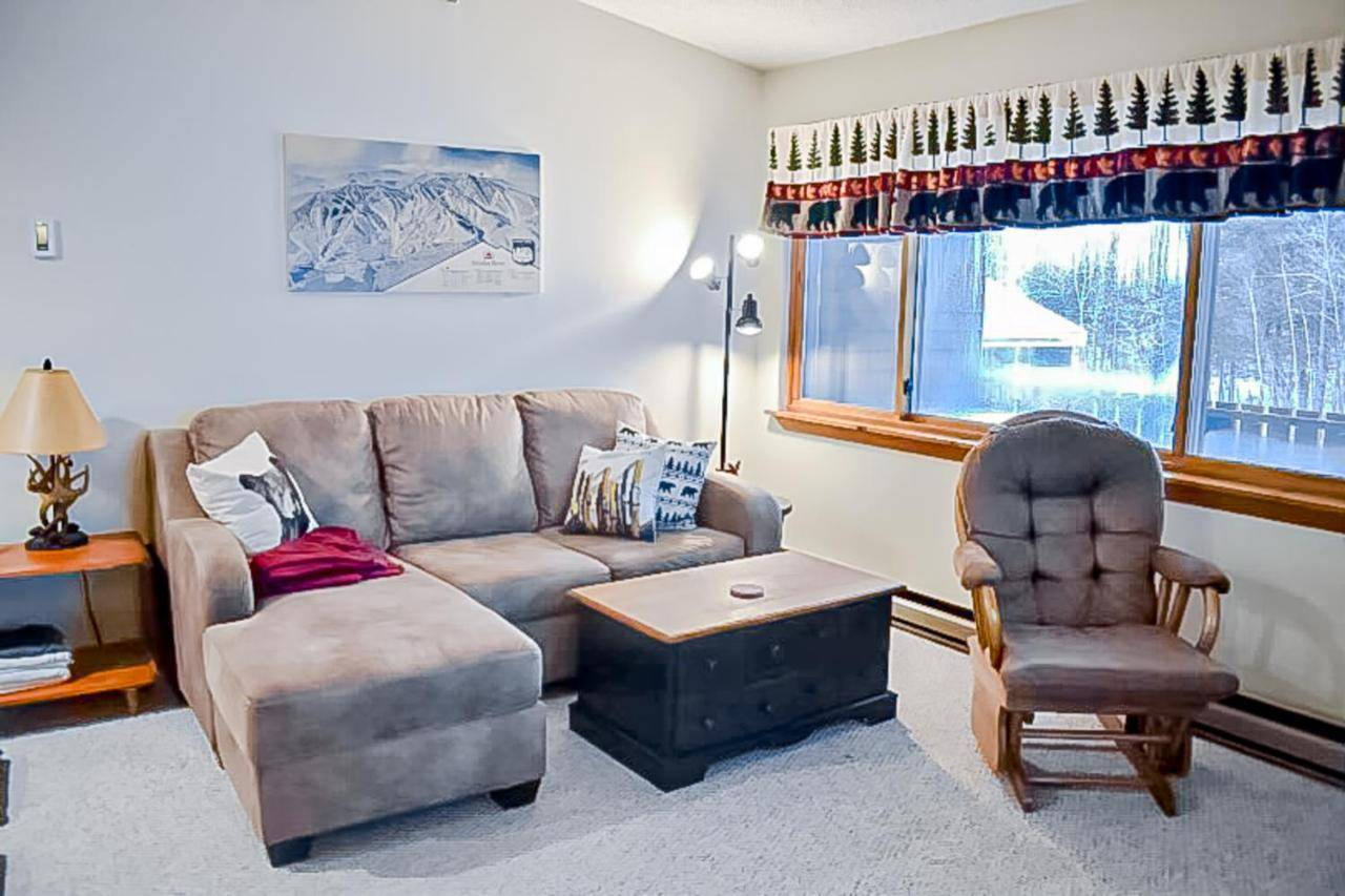 a living room with a couch and a chair at Fall Line W212 in Newry