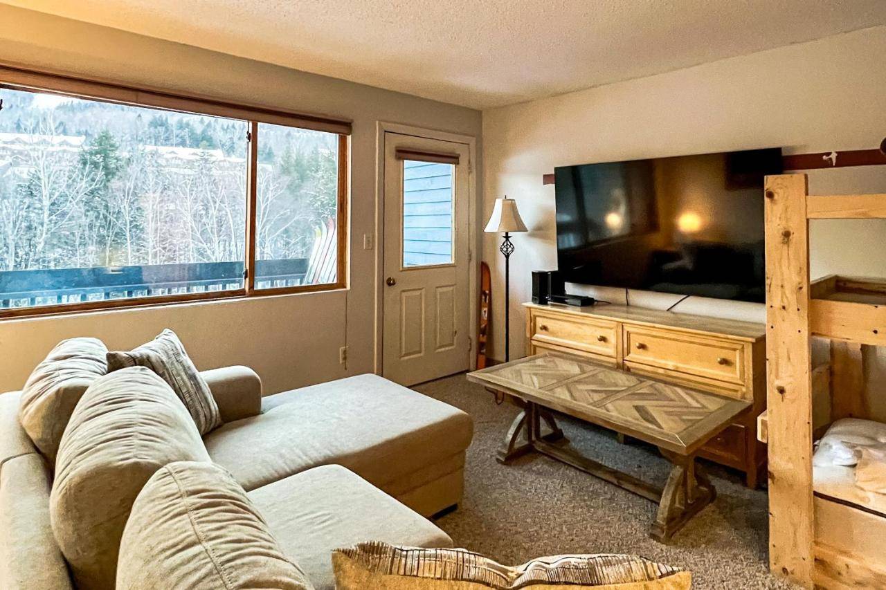 a living room with a couch and a flat screen tv at Roadrunner 2 A206 in Newry