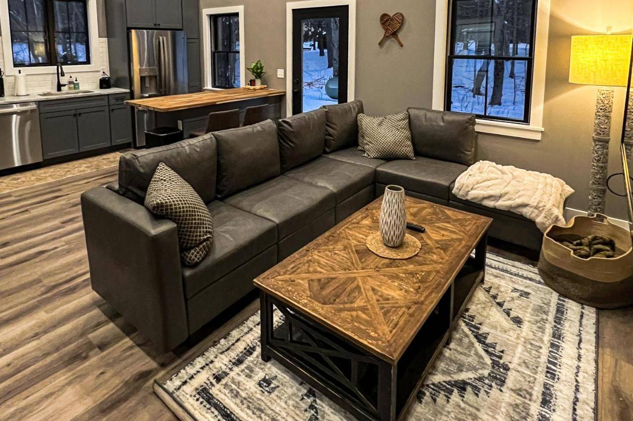 a living room with a couch and a table at Skiing Duck Escape in Newry