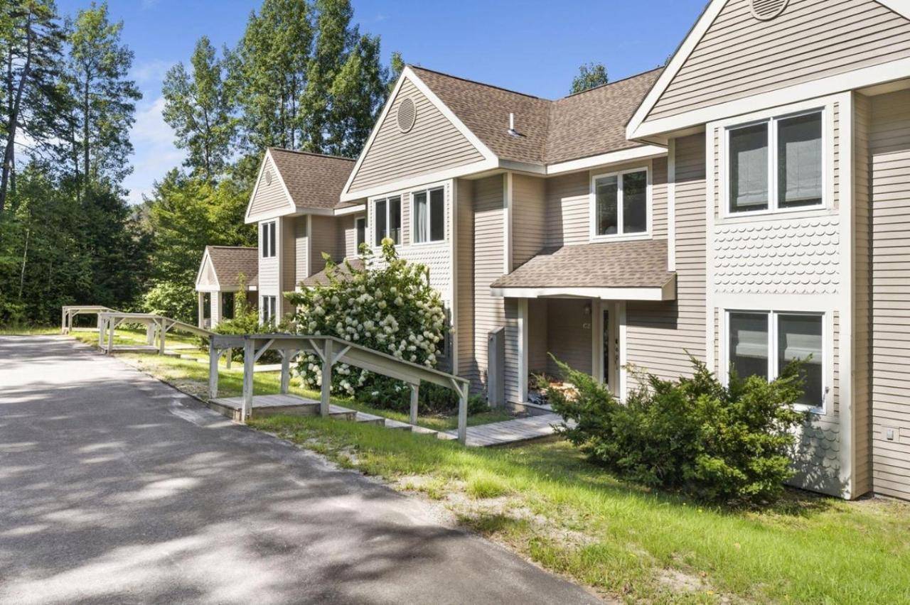 a house with a street in front of it at New host! Exceptional Sunday River Ski In Ski Out Condo in Newry