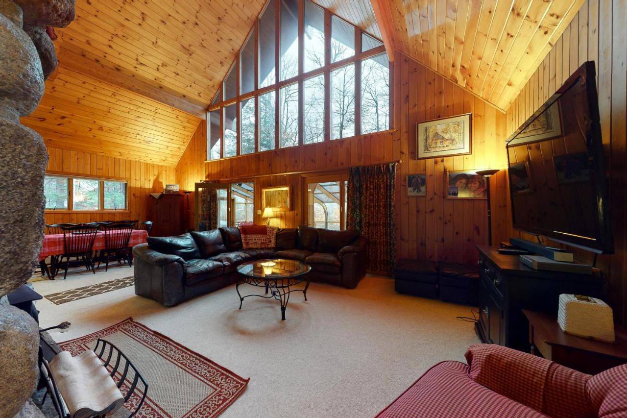 a living room with a couch and a table at Sunday River Village Timberline in Newry
