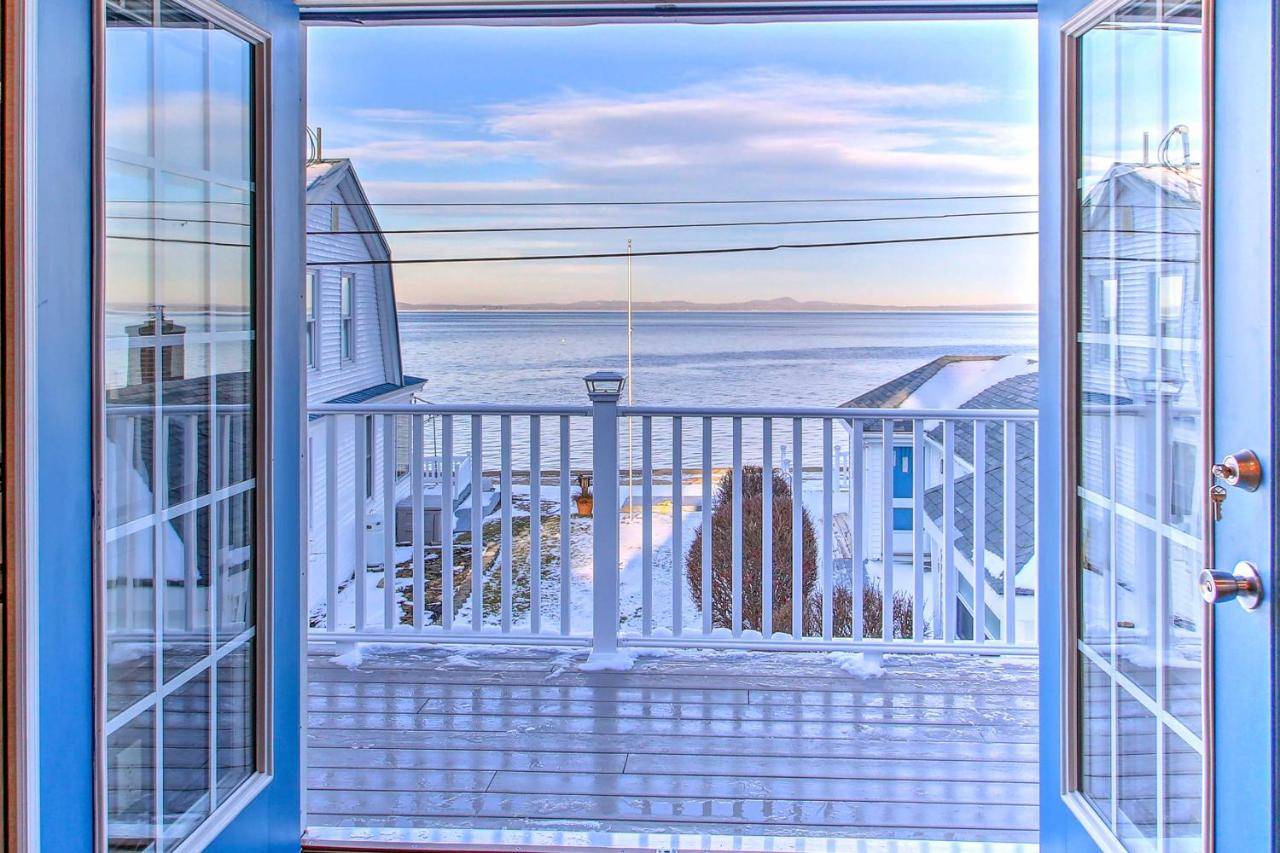 a view of the ocean from a balcony on a cruise ship at Sebago Lake Haven Water Views, Steps to Shoreline in North Sebago