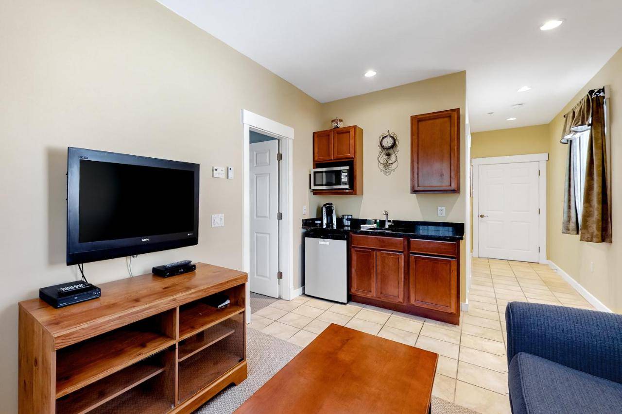 a large living room with a flat screen tv at The Colonels Suites Unit 1 in Northeast Harbor