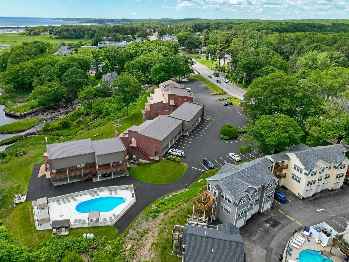 an aerial view of a resort with a pool and buildings at Ogunquit River Inn & Suites in Ogunquit