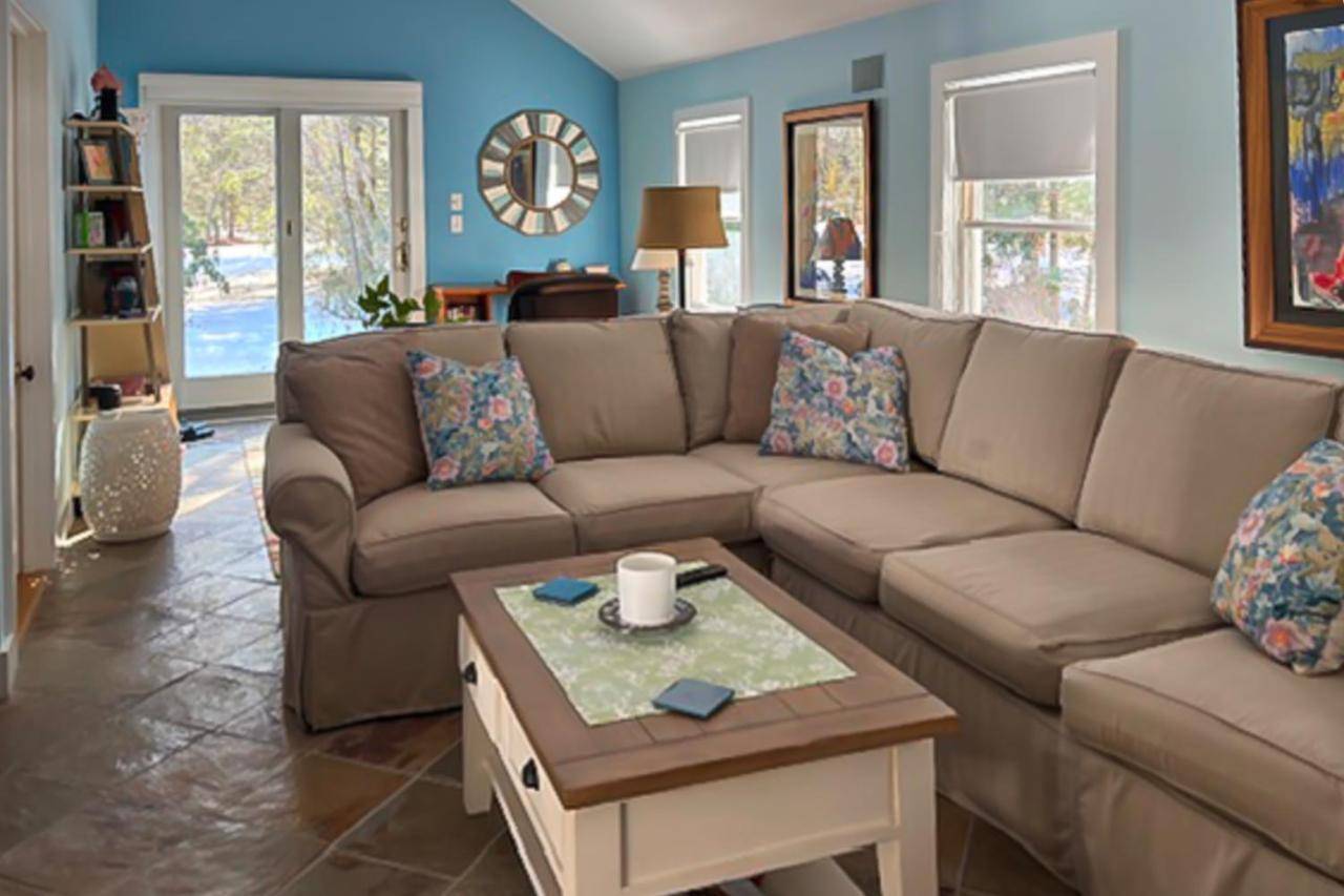 a living room with a couch and a coffee table at Saltwater Cottages in Ogunquit
