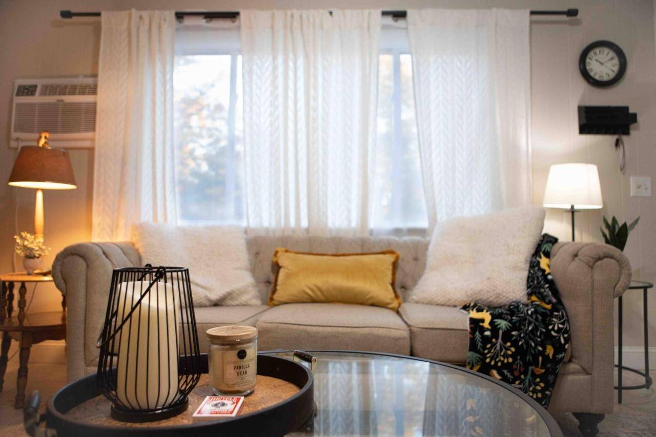 a living room with a couch and a coffee table at Chez Moi At The Beach! in Old Orchard Beach