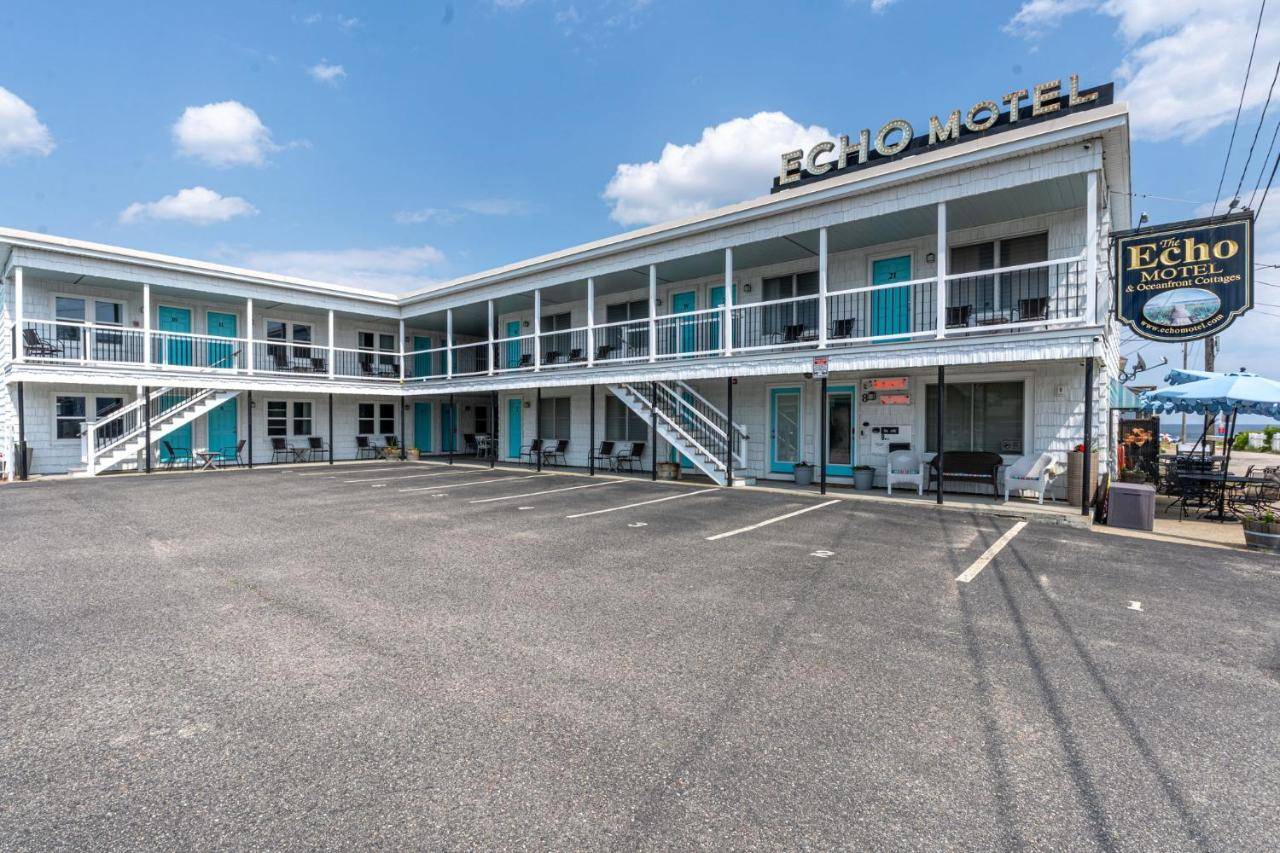 a large parking lot in front of a hotel at Echo Motel in Old Orchard Beach
