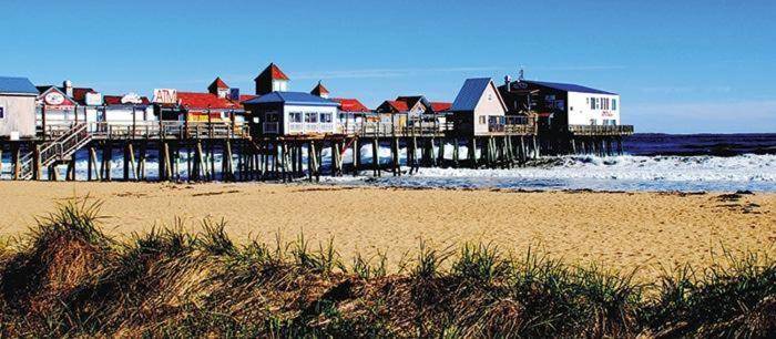 a group of houses on a pier on the beach at Lido Deck 101 in Old Orchard Beach