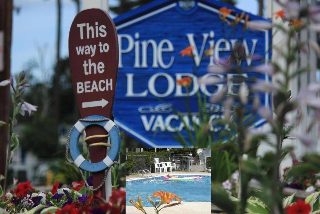 a sign for a swimming pool at a theme park at Pine View Lodge Old Orchard Beach in Old Orchard Beach