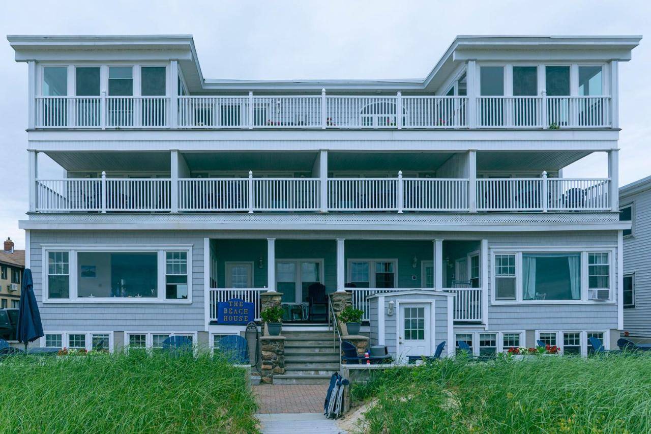 a large white house with a large balcony at The Beach House in Old Orchard Beach