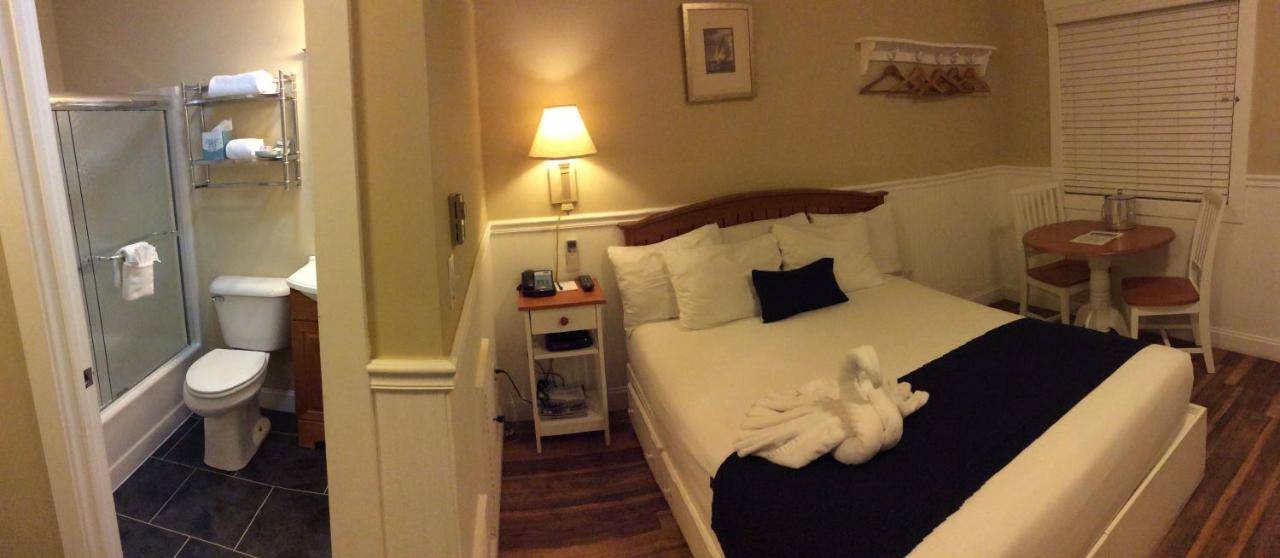 a bedroom with a bed with a stuffed animal on it at The Beachwood in Old Orchard Beach