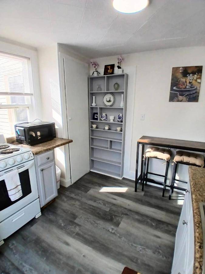 a kitchen with a stove and a counter top at Updated studio 7 minute walk to beach FREE Park! in Old Orchard Beach