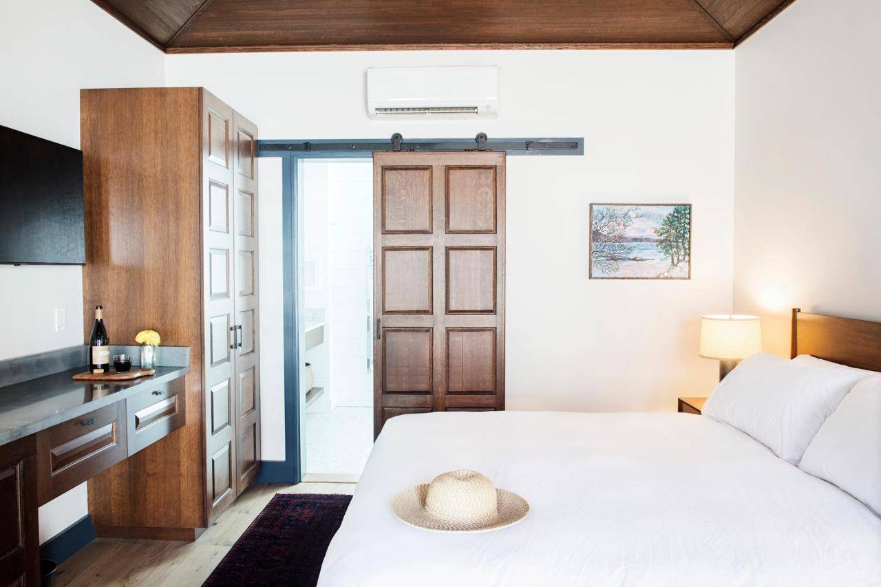 a bedroom with a bed with a hat on it at Best Bower in Portland