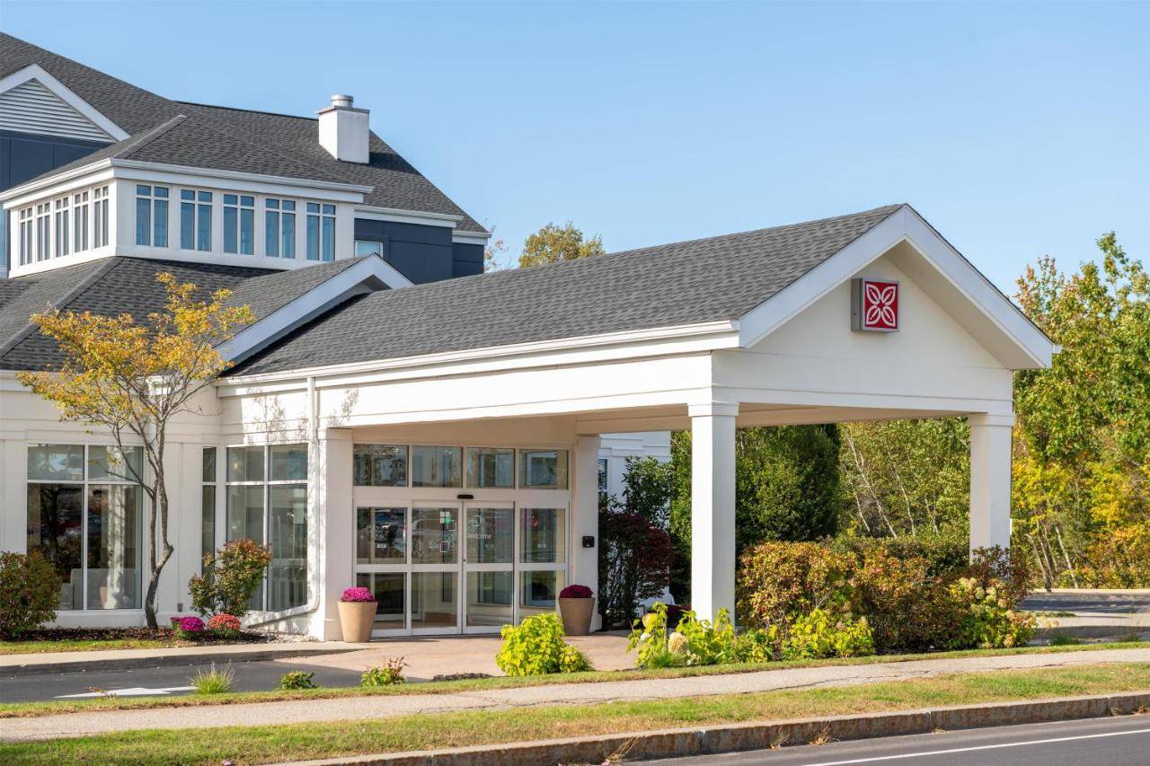 a home with a large white house at Hilton Garden Inn Portland Airport in Portland