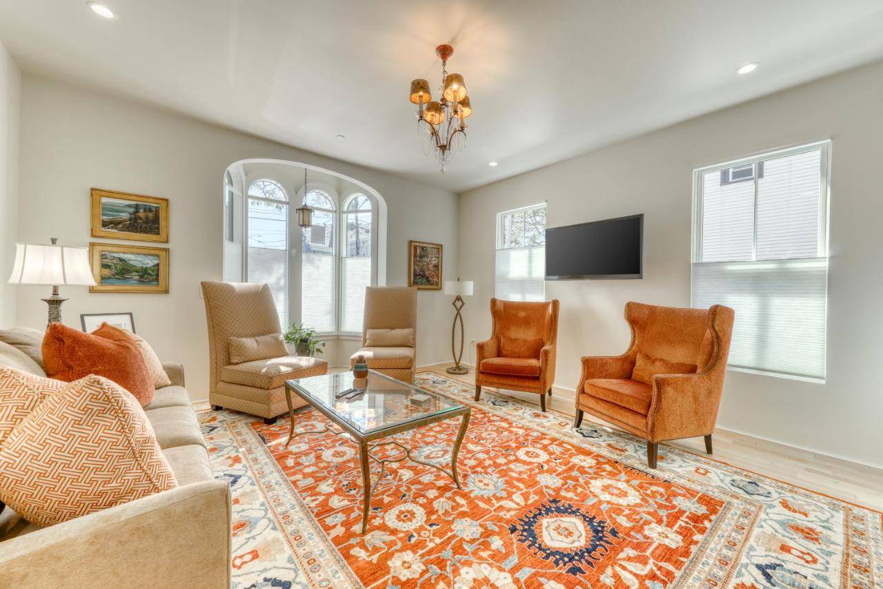 a living room with a couch and chairs and a table at Pearl of Portland in Portland