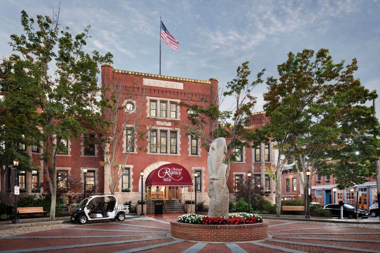 a building with an american flag on top of it at Portland Regency Hotel & Spa in Portland