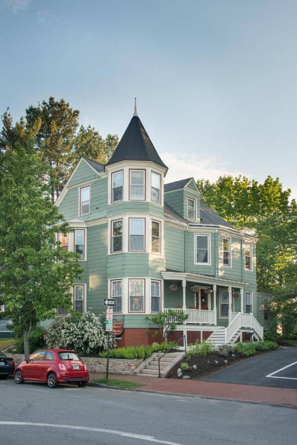 a green house with a red car parked in front of it at The Chadwick Bed and Breakfast in Portland