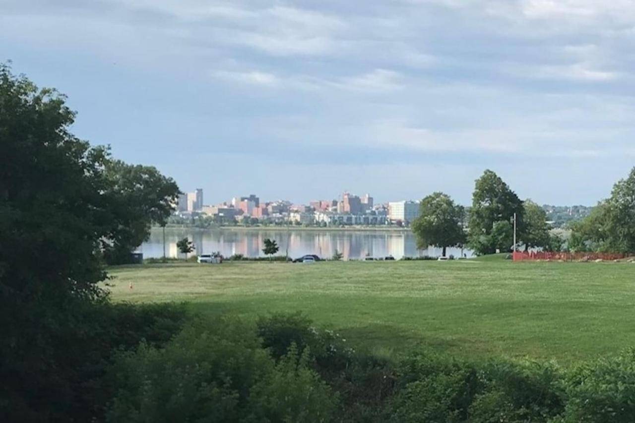 a park with a lake and a city in the background at Top Deck Portland Property with Views in Portland