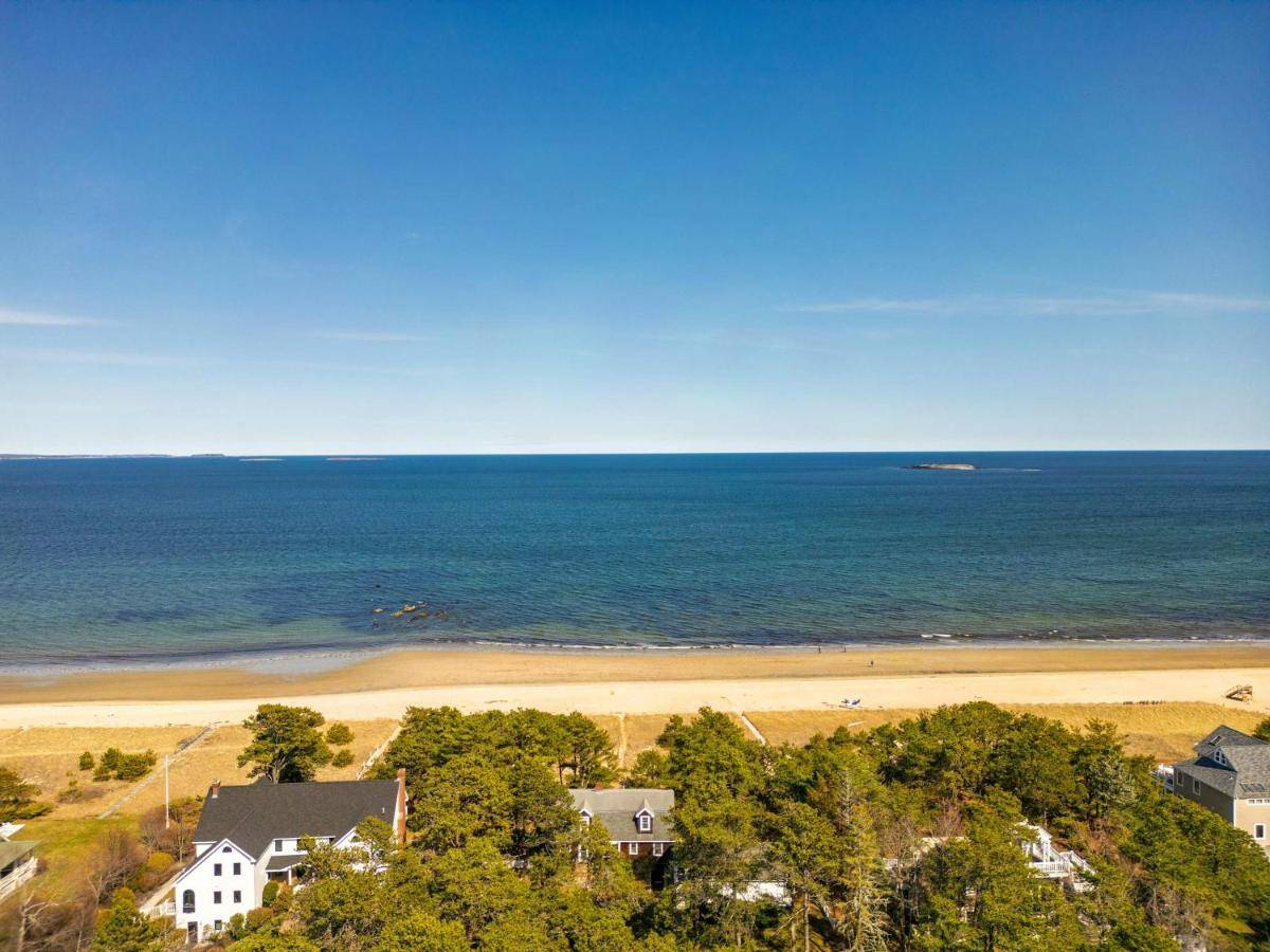 an aerial view of a beach with a house at Beachside Oceanside Walk onto the beach in Saco