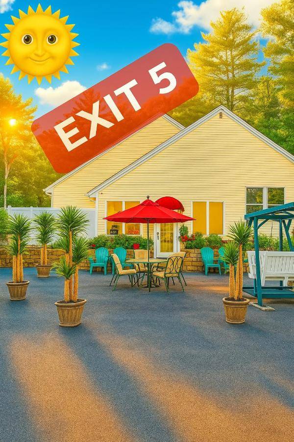 a drawing of a house with a table and umbrella at Exit 5 Resort & Condominium in Saco