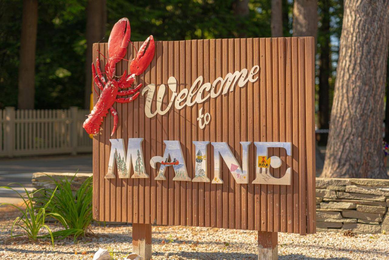 a sign that says welcome to new mum at Sun Outdoors Saco Old Orchard Beach in Saco
