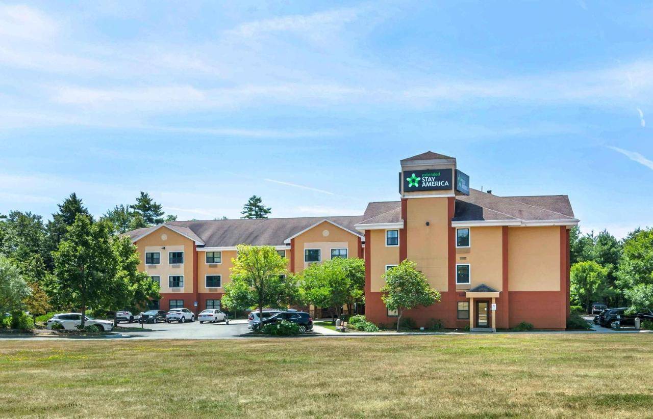 a hotel with a clock tower on top of it at Extended Stay America Suites - Portland - Scarborough in Scarborough