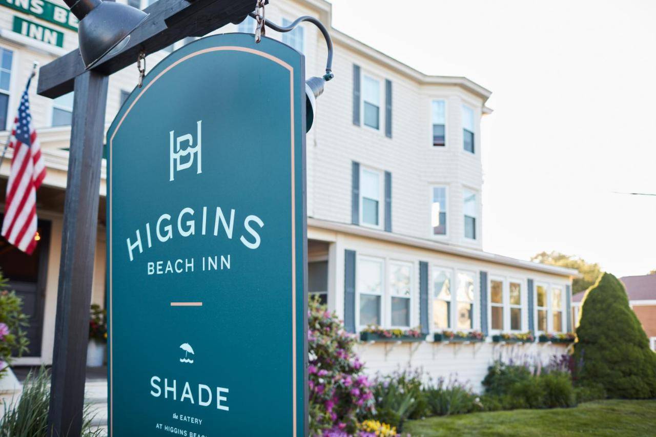 a blue sign in front of a house at Higgins Beach Inn in Scarborough