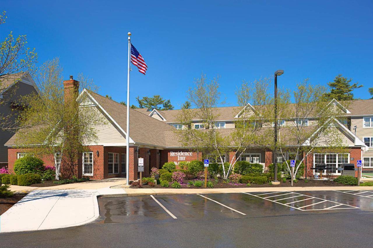 a building with an american flag in front of it at Residence Inn by Marriott Portland Scarborough in Scarborough