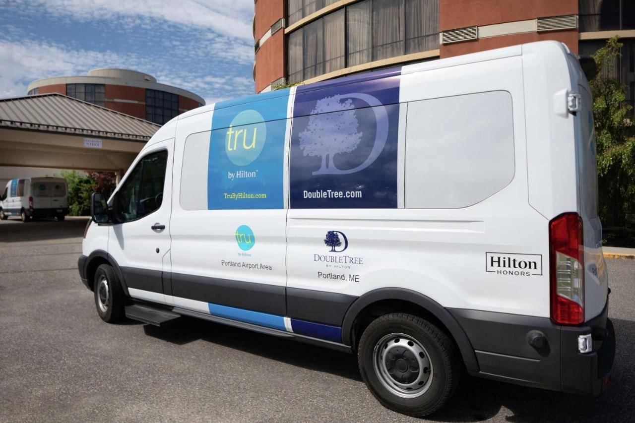 a white van parked in front of a building at DoubleTree by Hilton Portland, ME in South Portland