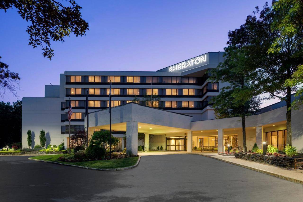 a rendering of a hotel building at night at Portland Sheraton at Sable Oaks in South Portland