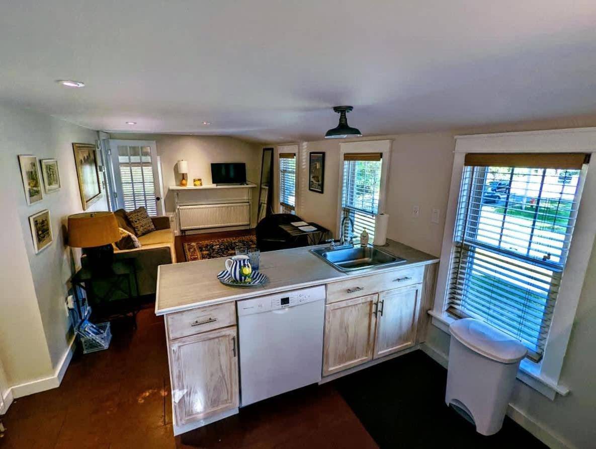 a kitchen with a sink and a counter top at Acadia Park Suites 2 in Southwest Harbor