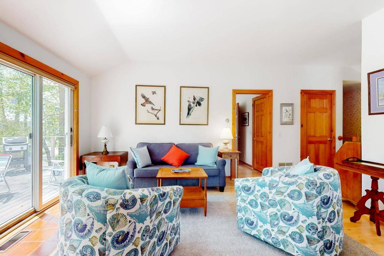 a living room with a couch and two chairs at The Birdhouse of Maine in Southwest Harbor