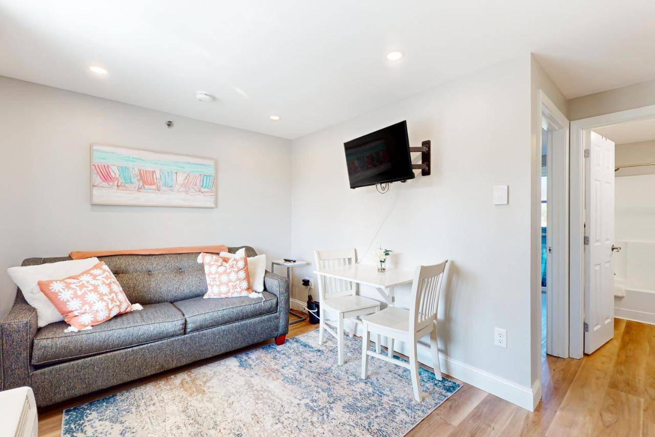 a living room with a couch and a table at 204 at the Shore in Wells