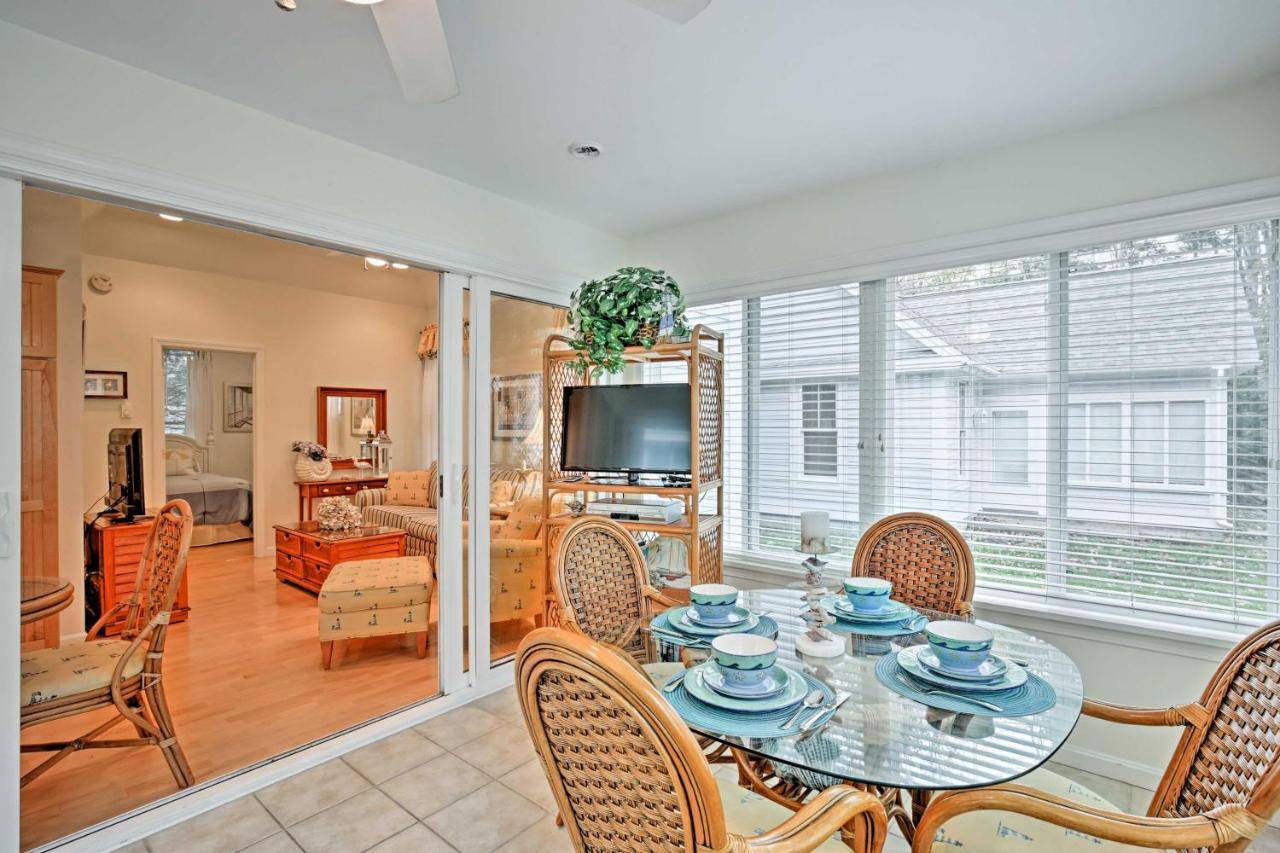 a dining room with a table and chairs at Coastal Wells Cottage with Access to Game Room and Gym in Wells