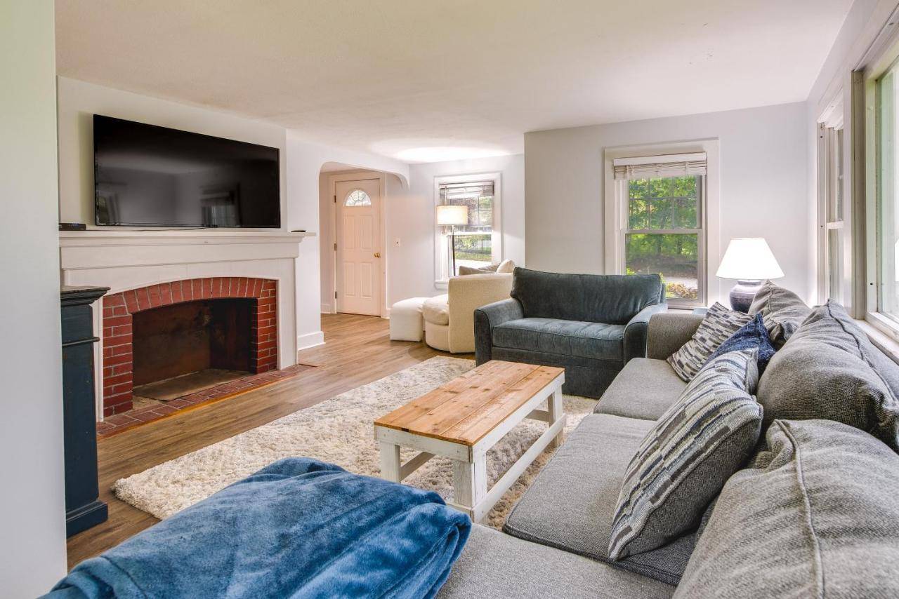 a living room with a couch and a fireplace at Near Beach Coastal Maine Getaway with Yard in Wells