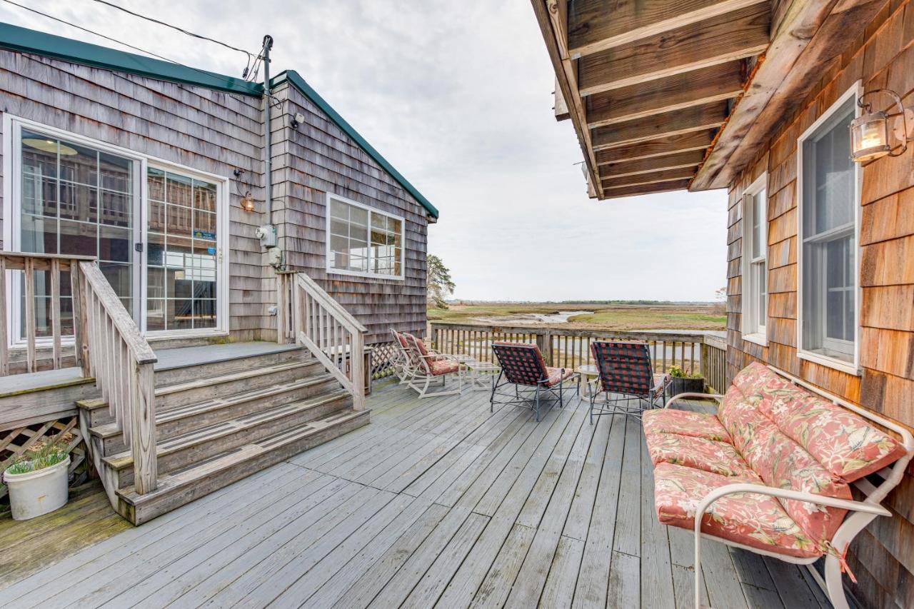 a deck with chairs and a couch on a house at Peaceful Wells Retreat with Deck and Water Views in Wells