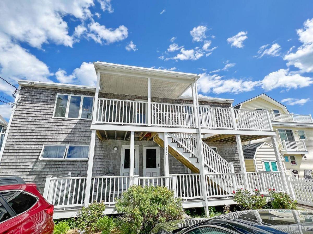 a large house with white railings at Sandcastle W148 in Wells