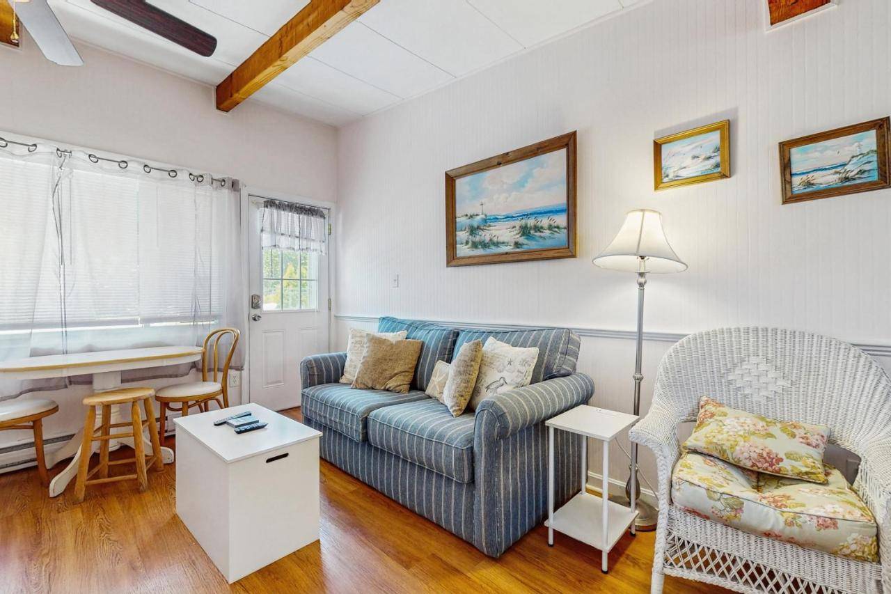 a living room with a couch and a table at Sea Glass Escape - Holiday House M3 in Wells