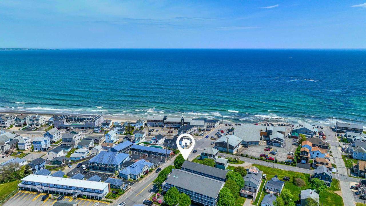 an aerial view of a town next to the ocean at Serenity by the Sea - 180 Steps to the Beach in Wells