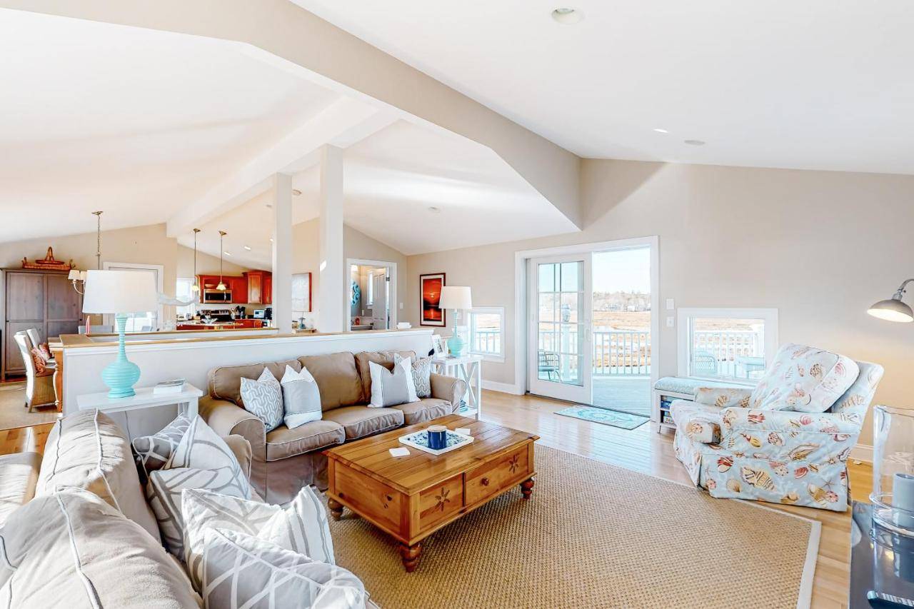 a living room with a couch and a table at Sunset View in Wells