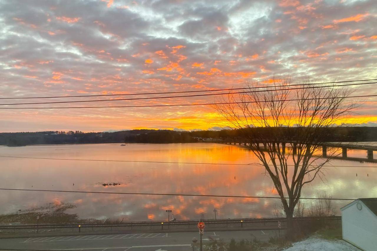 a view of a body of water at sunset at Sheepscot River Perch in Wiscasset