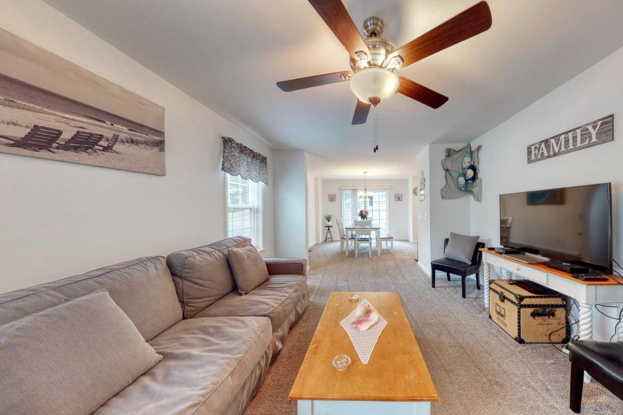 a living room with a couch and a ceiling fan at Beacon Retreat in York