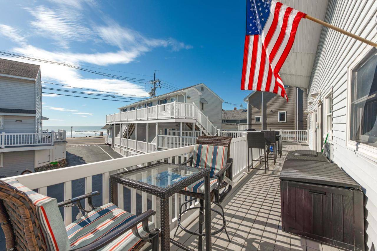 a balcony with an american flag on a house at Cozy York Studio with Ocean View, Steps to Beach! in York