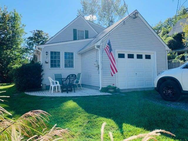 a house with an american flag in the yard at Family Retreat at York Beach in York