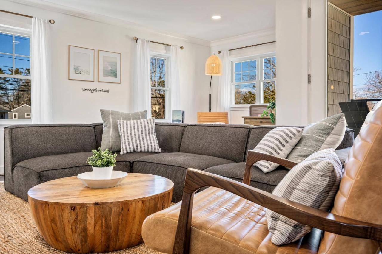 a living room with a couch and a table at Game Room Home Gym 1 Mile to Beach in York