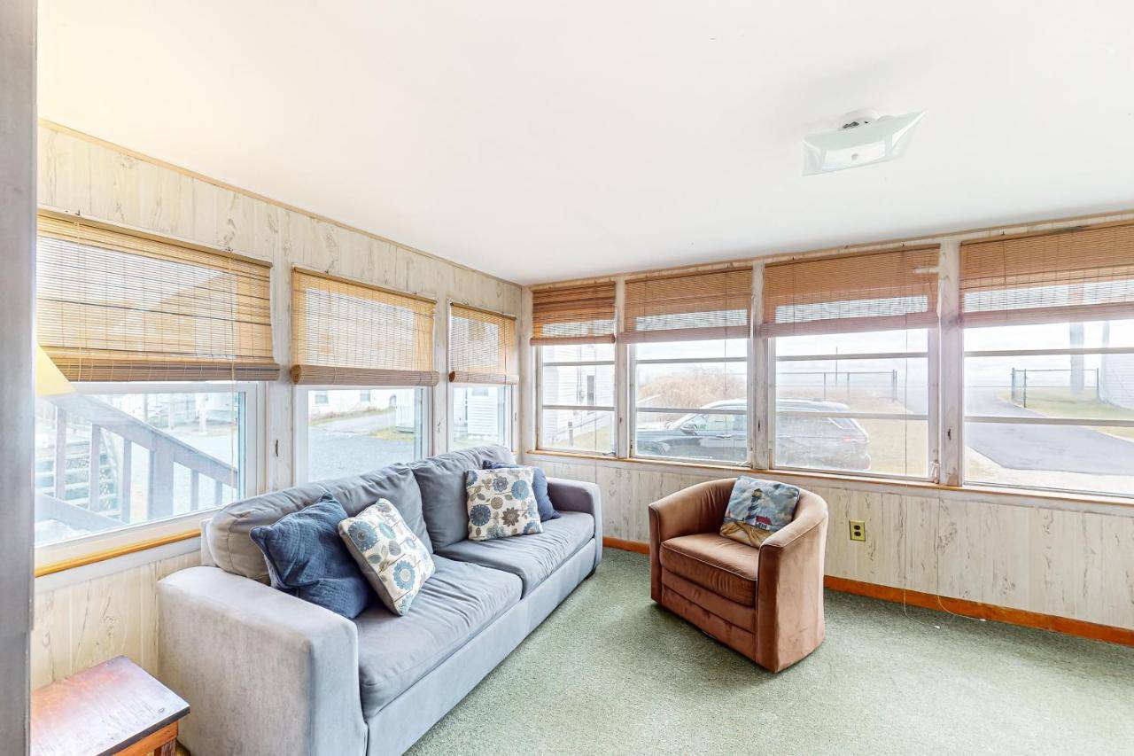 a living room with a couch and a chair at Gull's Getaway in York