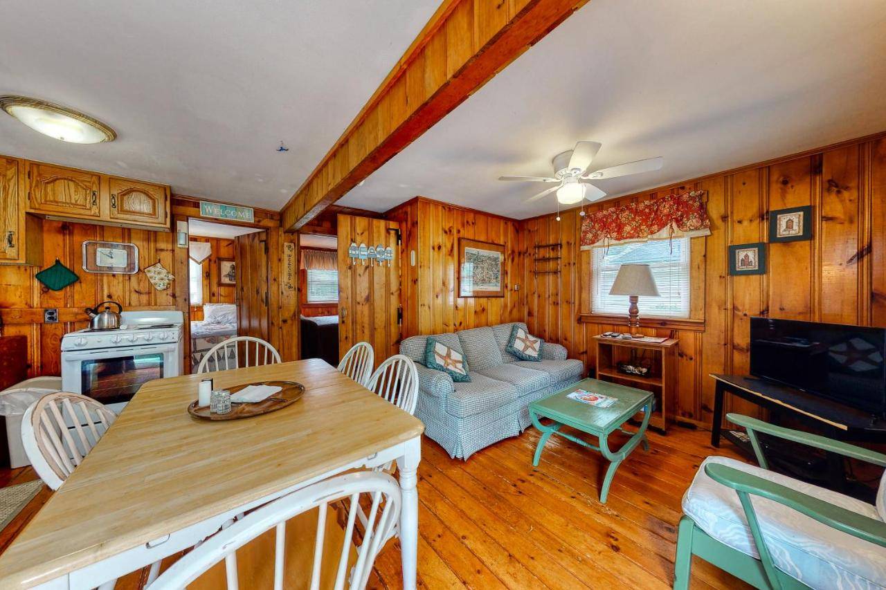 a living room with a couch and a table at Little Cottage in York