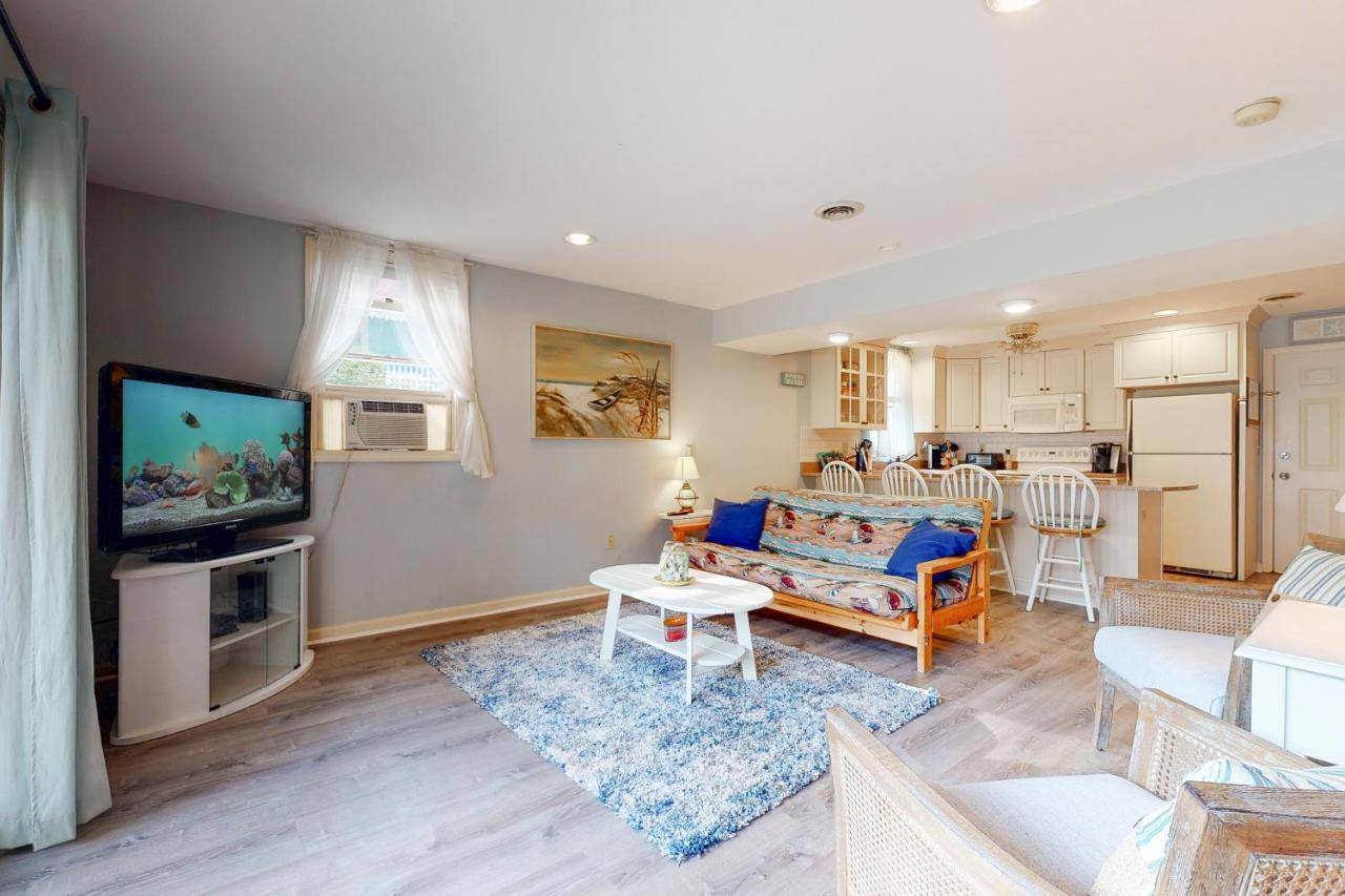 a living room with a couch and a tv at Long Sands Escape in York