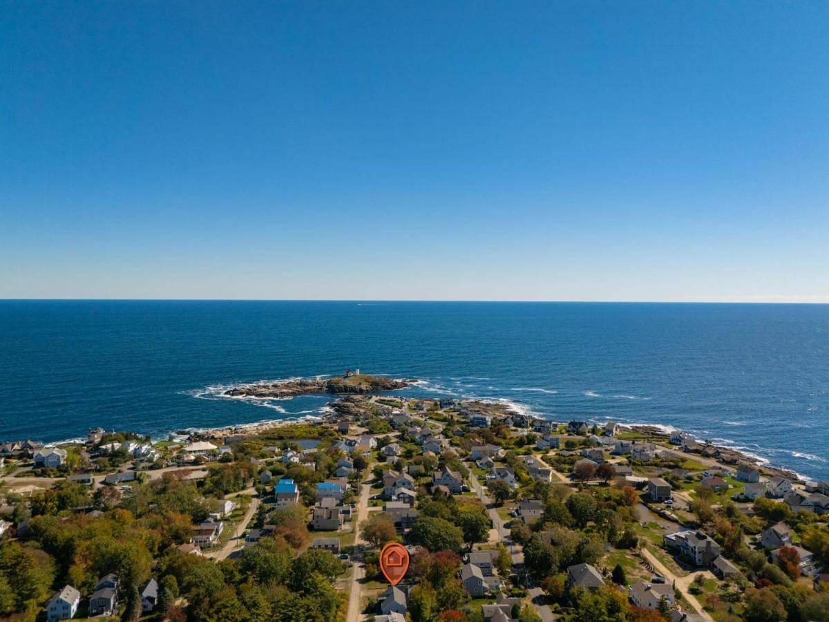 an island in the ocean with a stop sign at Nubble View - Home for 10 in York